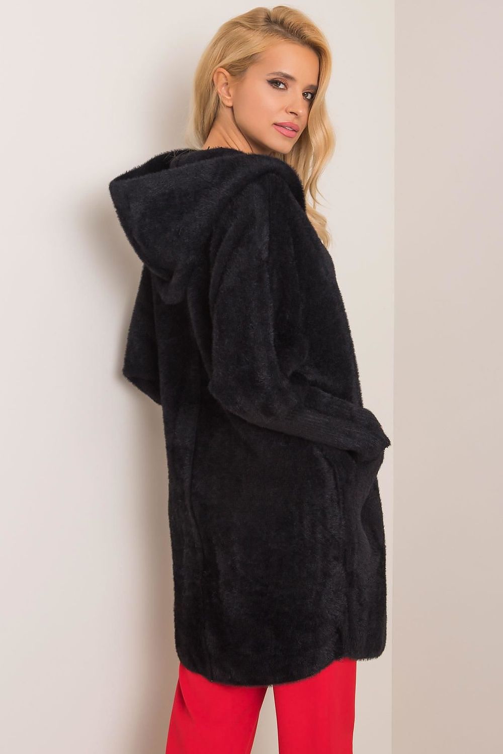 Stylish black women's coat in a premium wool blend, designed with a hood and practical slip pockets, offering elegance for autumn wear.