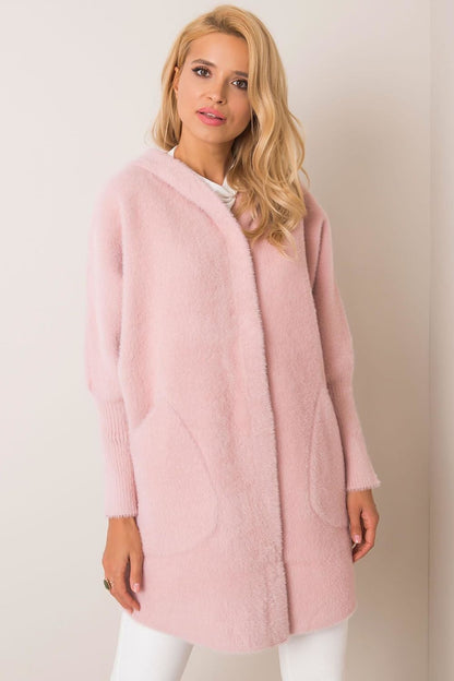 Elegant luxury women's wool blend coat in soft pink, featuring a hood, generous slip pockets, and a sophisticated design, perfect for autumn layering.