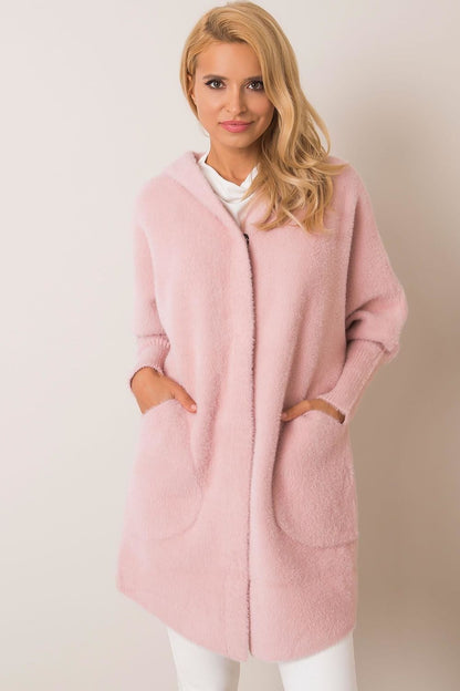 Chic women's luxury wool blend coat in a gentle pink hue, featuring a modern hood design and practical slip pockets, combining elegance and comfort for autumn wear.