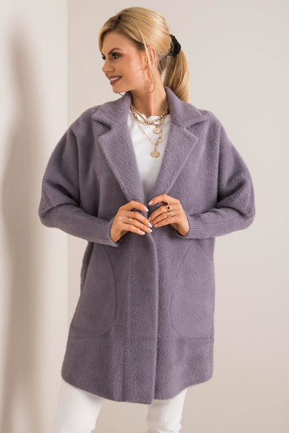 Elegant luxury women's wool blend coat in soft lilac, featuring angora blend and stylish press stud fastening, perfect for autumn wear. Styled with a chic layered necklace, enhancing the sophisticated look.