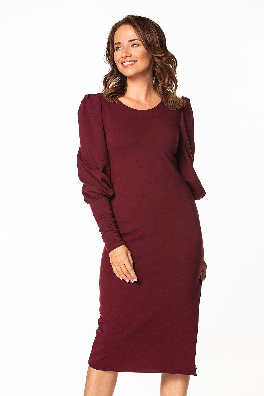 Elegant knitted midi dress by Tessita, featuring a flattering boat neckline and long buff sleeves, perfect for sophisticated occasions.
