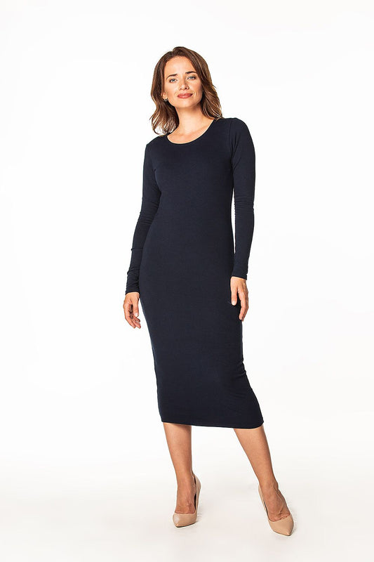 Tessita long sleeve cotton dress displayed on a model, highlighting its sleek fit and timeless boat neckline, perfect for any occasion.