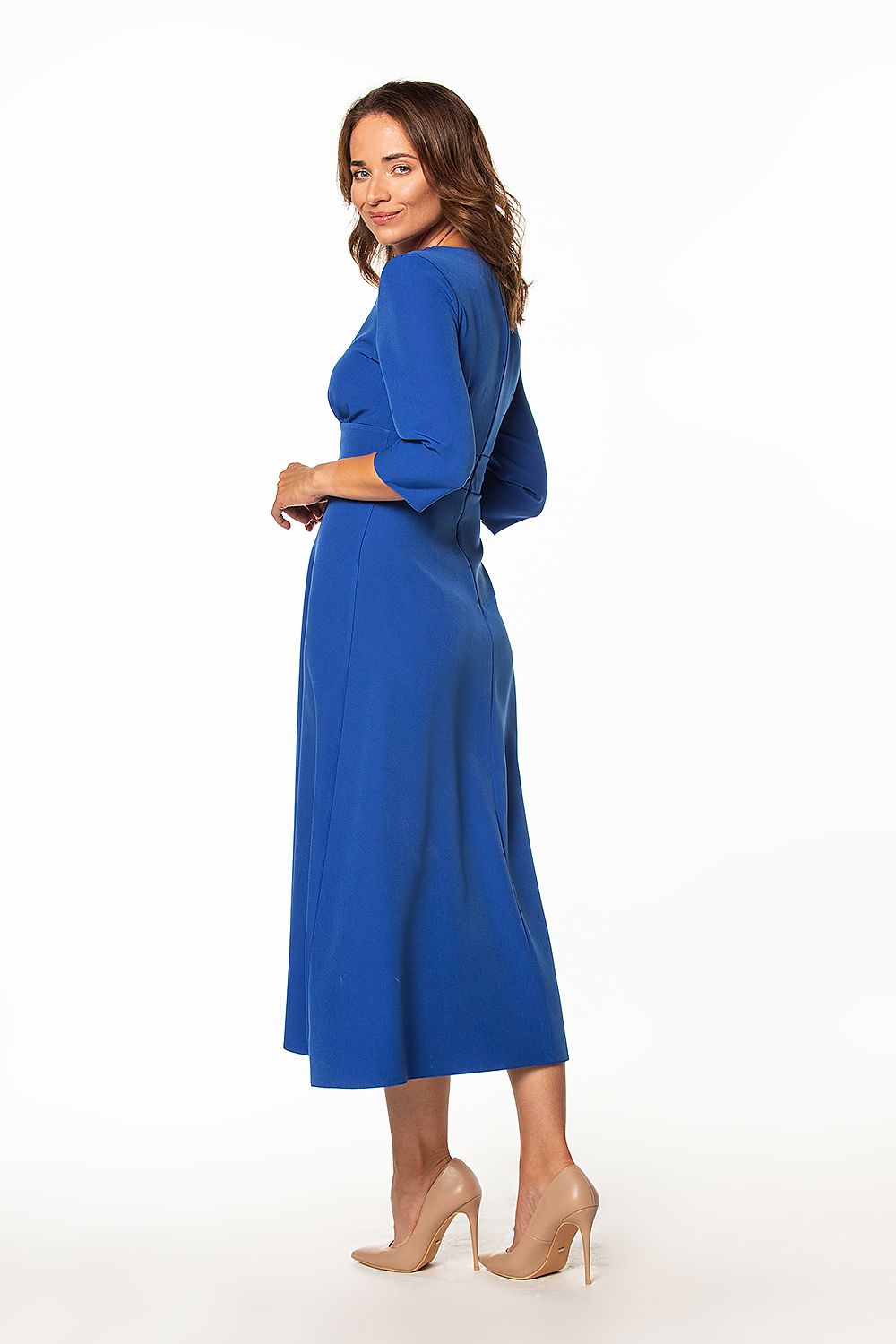 Chic Tessita blue maxi dress with a graceful silhouette, complete with 3/4 sleeves and a covered zipper at the back, emphasizing elegance.