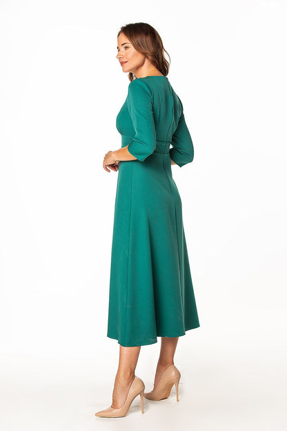 Stylish Tessita maxi dress featuring a graceful back design, highlighting the luxurious fabric and perfect for a variety of events.