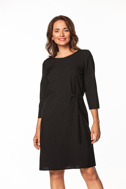 Elegant Tessita Midi Dress featuring a waist tie and 3/4 sleeves, perfect for sophisticated occasions.