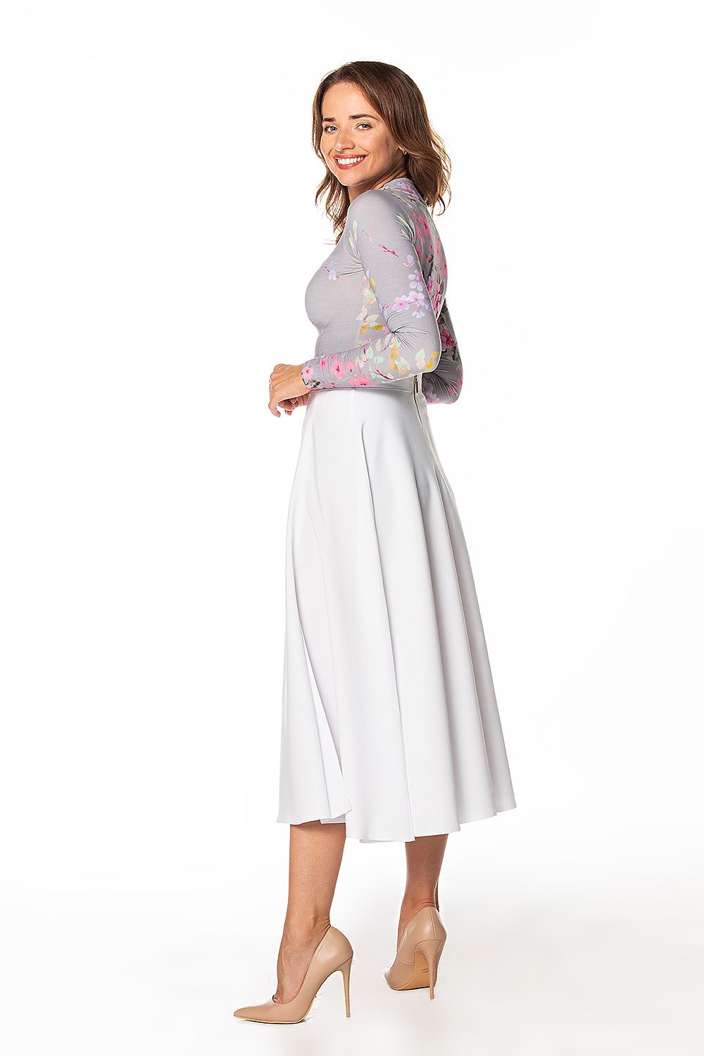 Elegant mid-calf Tessita skirt featuring a chic left side slit and decorative zipper, perfect for luxurious styling.