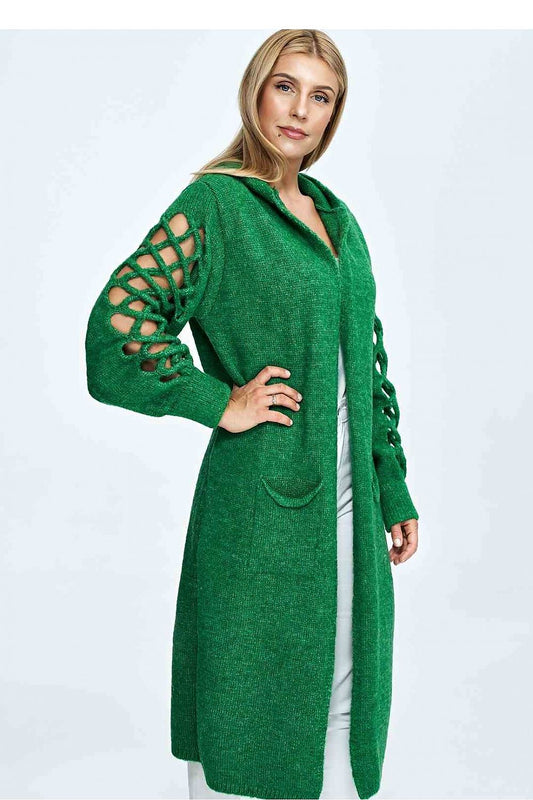 Elegant model showcasing a luxury long hooded cardigan by Figl, featuring decorative openwork sleeves and pockets in a vibrant green hue.