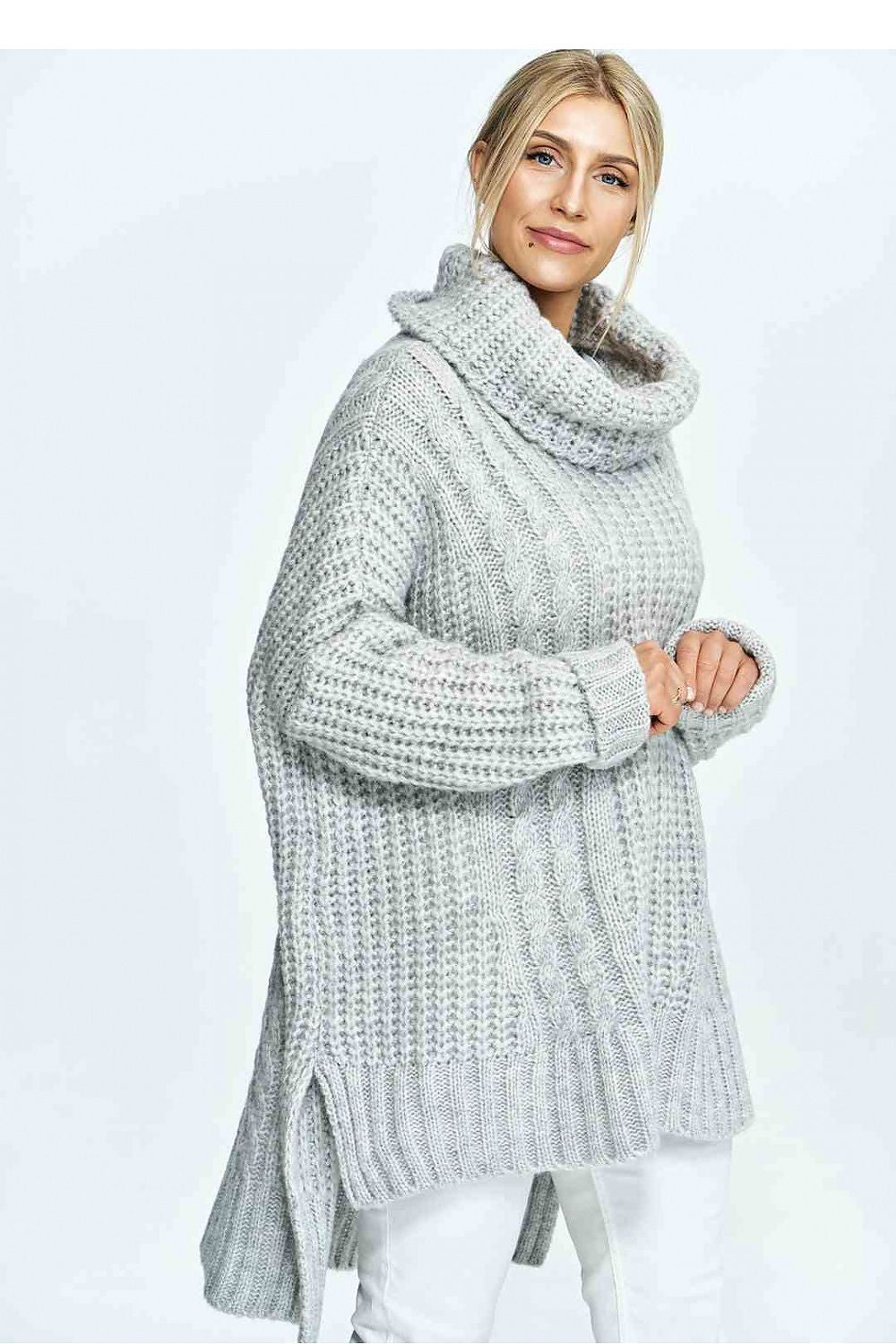 Stylish side view of a luxurious loose fit turtleneck sweater featuring a chic plaid pattern, ideal for modern women's fashion.