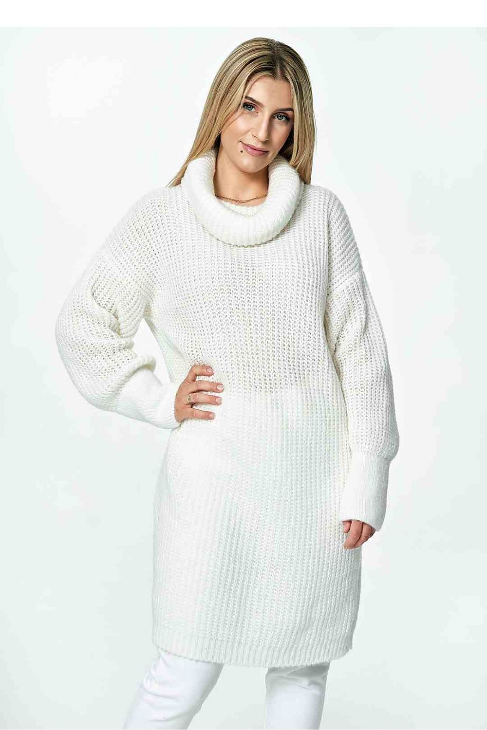 Front view of an elegant long Figl jumper in white, featuring a loose turtleneck and stylish long sleeves, model poses confidently.