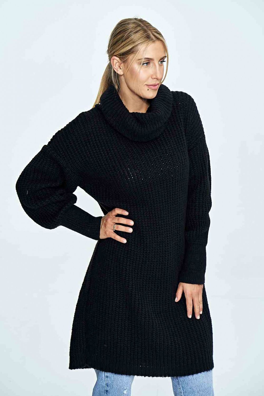 Model showcases the elegant Figl long black jumper with a loose turtleneck and long sleeves, perfect for luxury winter attire.