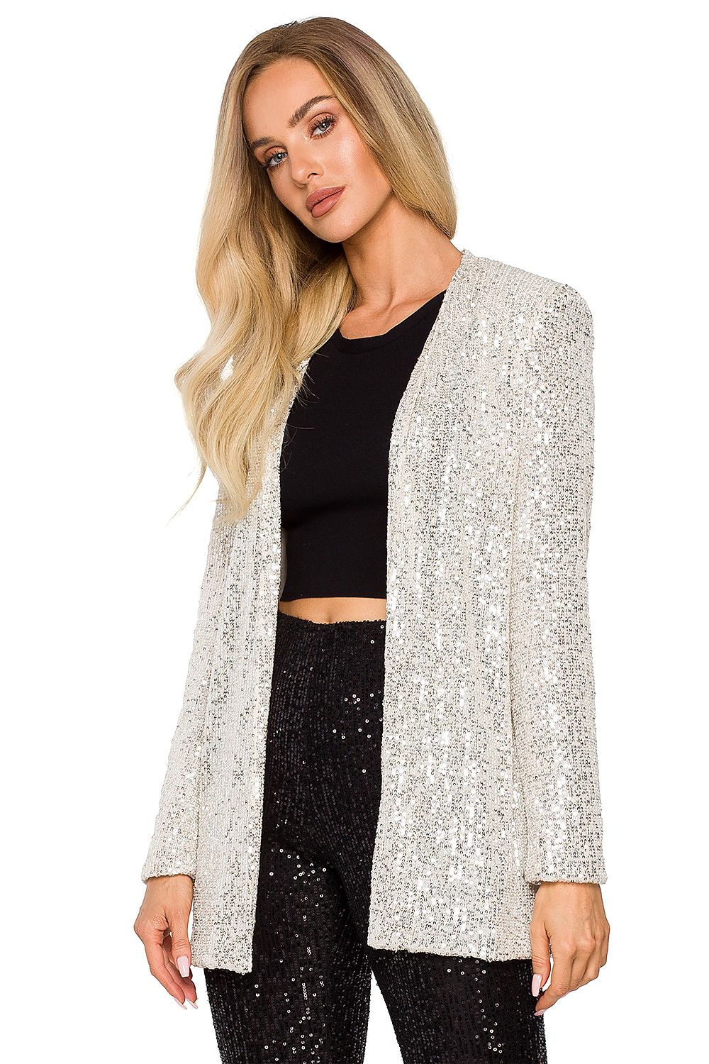 Elegant loose-fit silver sequin jacket, fully lined, styled over a black crop top, perfect for transforming any outfit into a glamorous evening look.