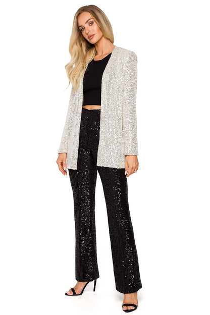 Chic silver sequin jacket paired with stylish black sequin trousers, showcasing a sophisticated party-ready ensemble.