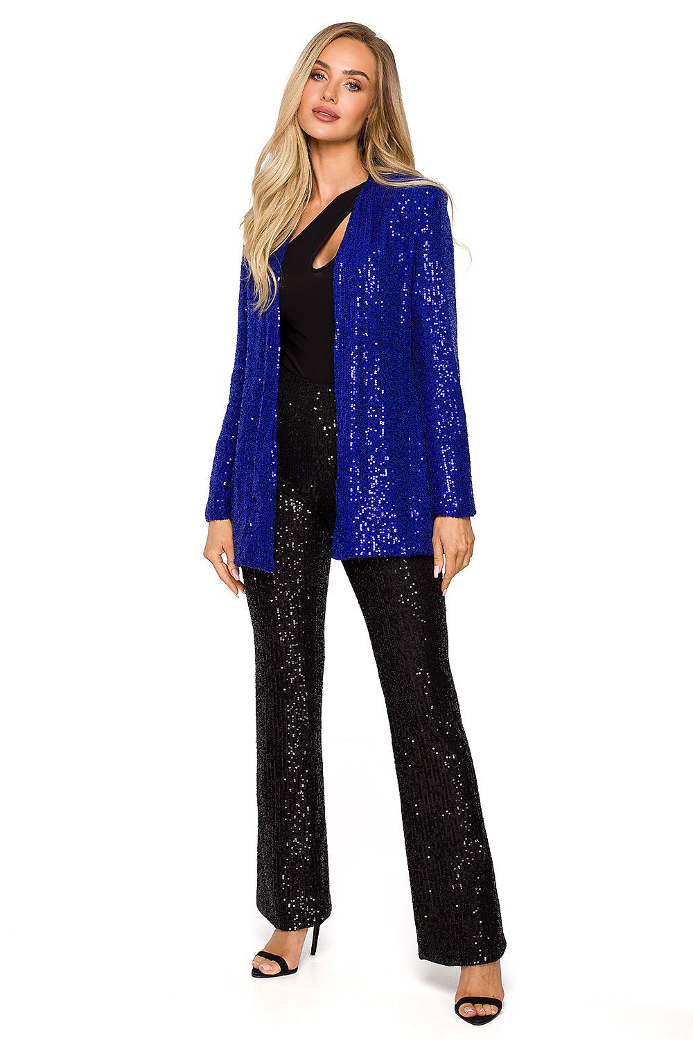 Model exuding elegance in a blue sequin jacket paired with sequined black trousers, highlighting chic party attire for special occasions.