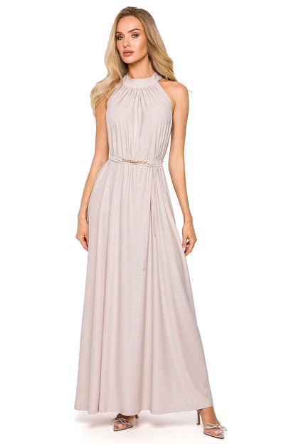 Graceful pale pink maxi evening dress with a halter neckline and complementing tie belt, ideal for glamorous occasions.