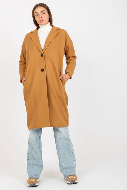Chic luxury women's single-breasted coat in rich camel, modelled with a stylish white turtleneck, featuring a sleek silhouette and practical slip pockets.