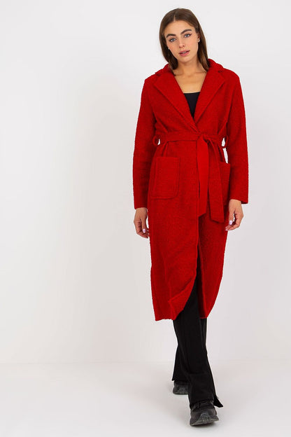 Elegant Och Bella women's long sleeve red coat with a tie belt, featuring patch pockets, showcased on a model. A sophisticated fashion statement for the modern woman.