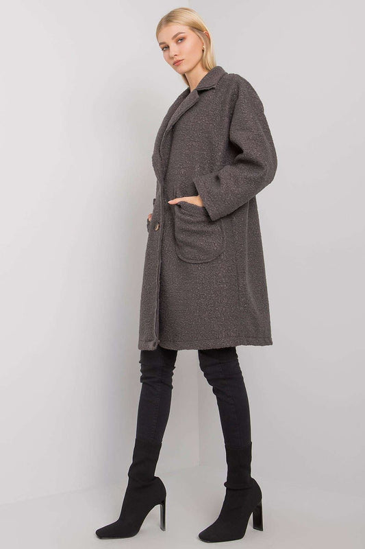 Stylish dark grey women's coat with a relaxed fit, showcased with long sleeves and ample patch pockets, perfect for sophisticated layering in transitional seasons.