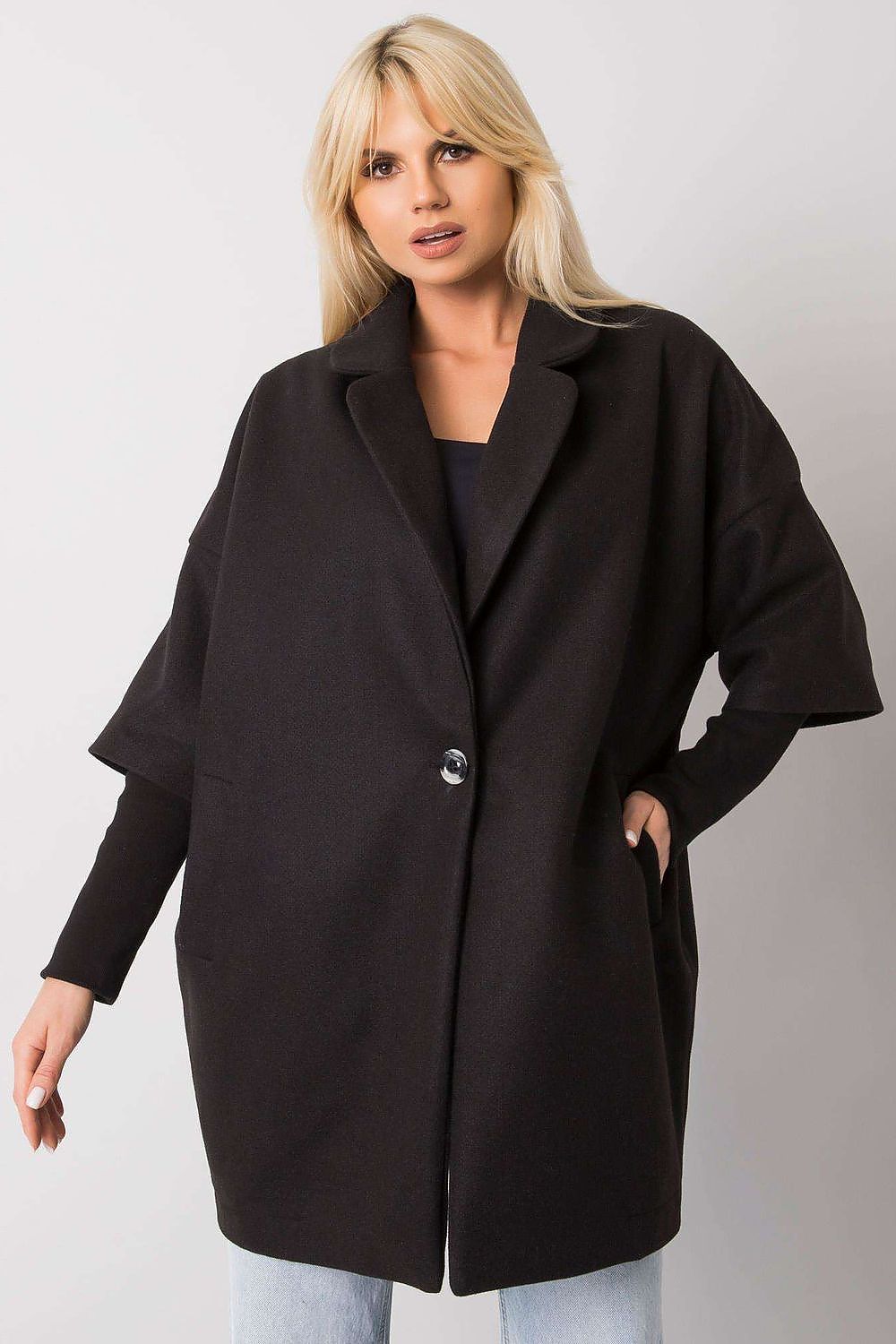 Elegant black women's coat by Rue Paris featuring a loose cut design, button closure, and practical side pockets, exuding sophistication and effortless style.