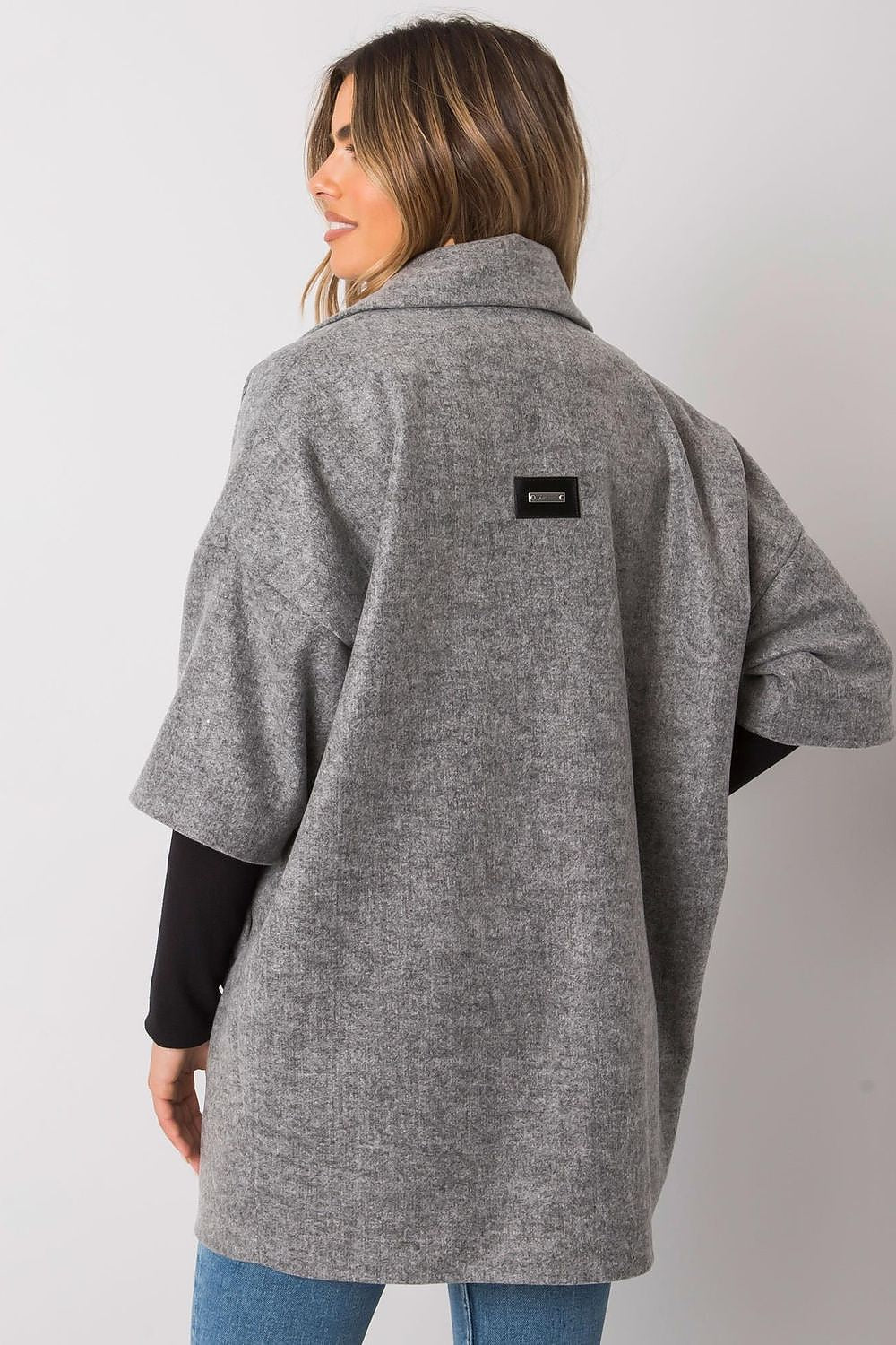 Sophisticated back view of a grey women's coat by Rue Paris, highlighting the fabric texture and design on a trendy model.