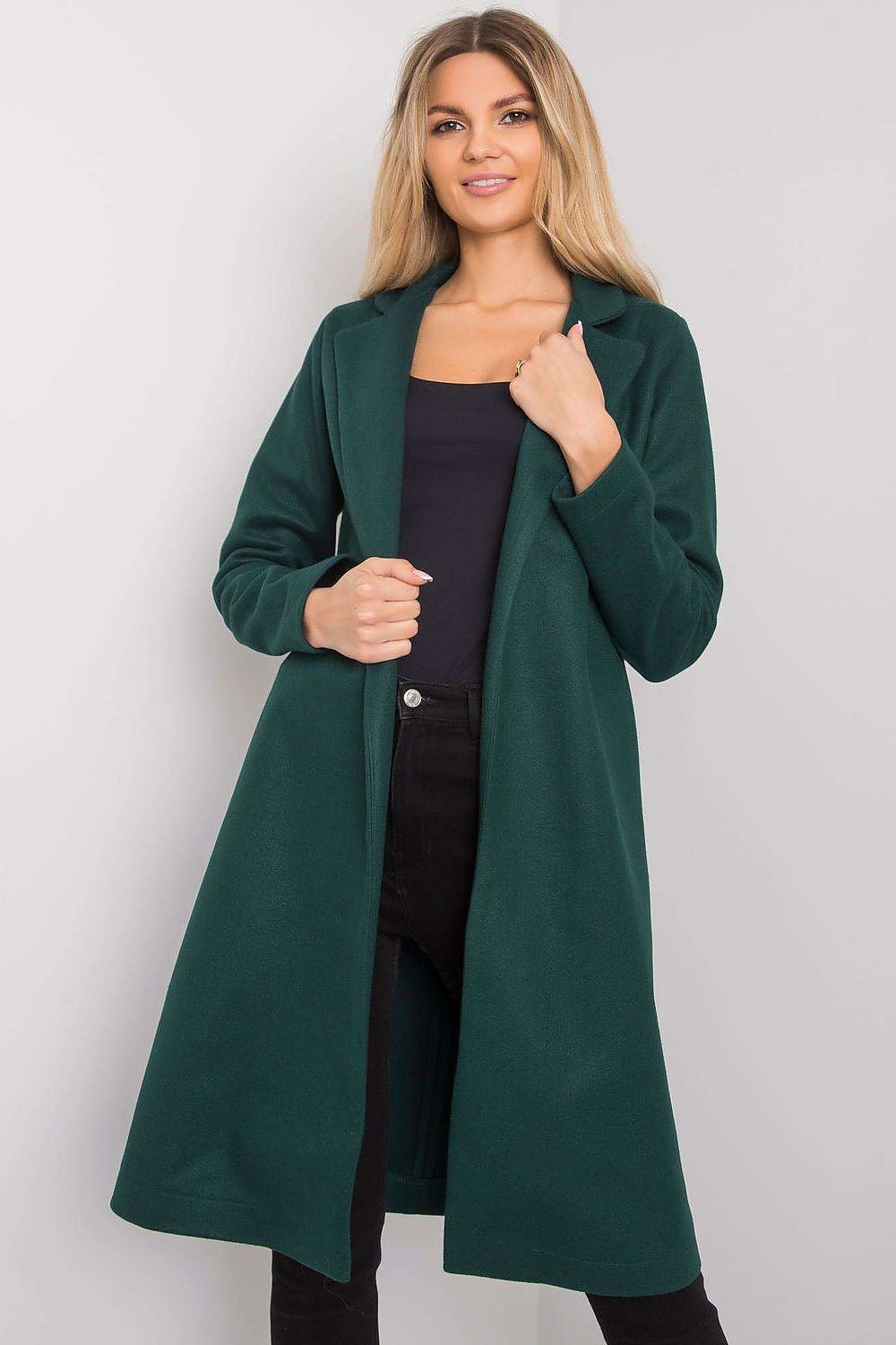 Luxurious green unlined long-sleeved coat for women by Rue Paris, featuring elegant collar and side pockets, styled with black outfit.