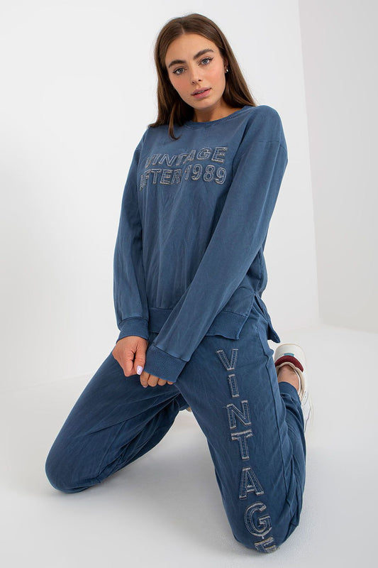 Luxurious women's cotton spandex sweatshirt set featuring a casual loose-fit sweatshirt with long sleeves and a stylish decorative inscription, paired with relaxed long pants with an elastic waistband, ideal for a chic yet comfortable look.