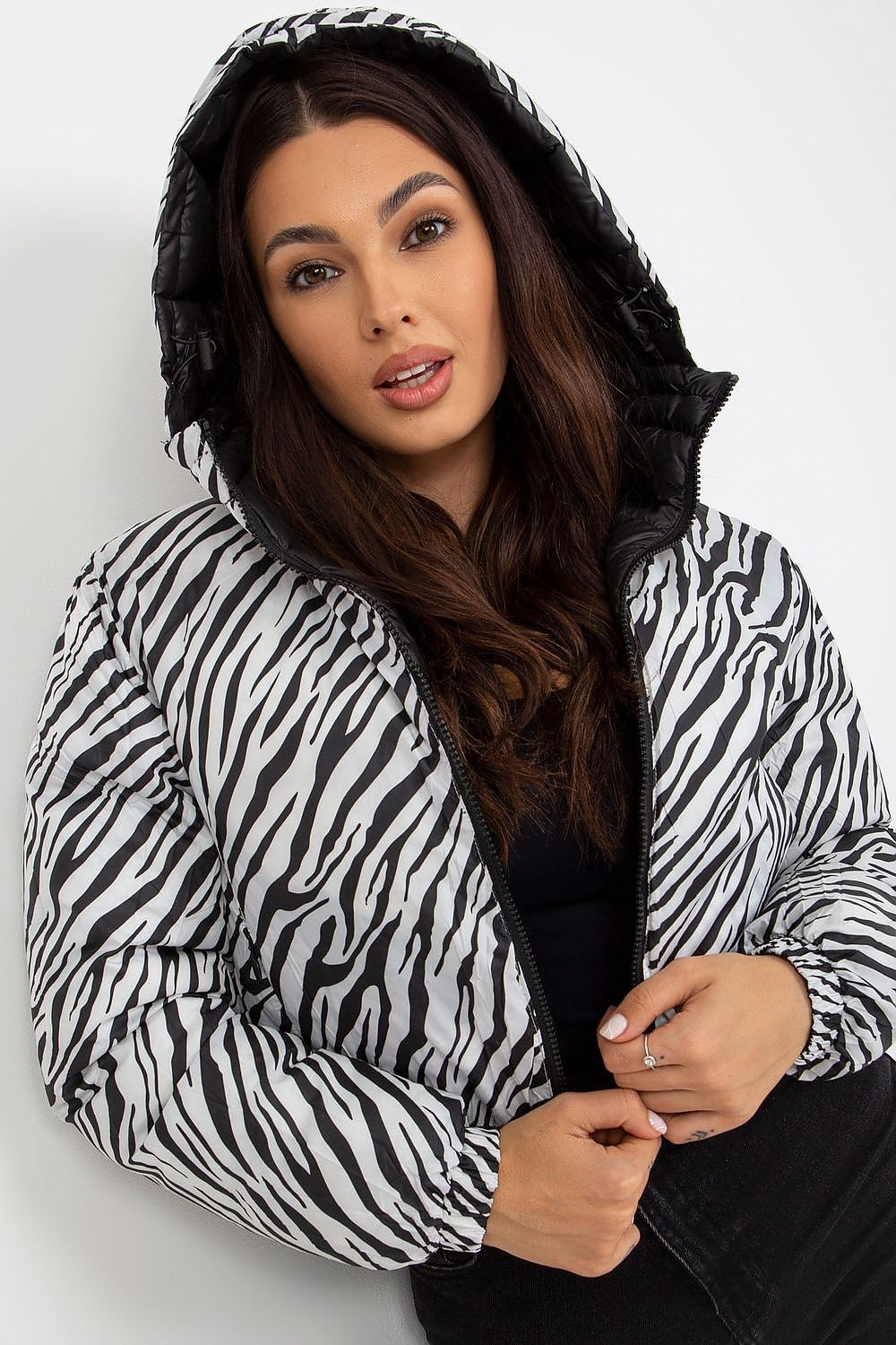Stylish luxury NM polyester jacket for men featuring a striking black and white zebra print, showcased by a model with long hair, exuding elegance and confidence.