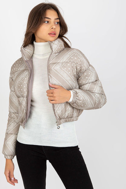 Elegant women's luxury NM polyester jacket in a nuanced beige hue, featuring a fashionable quilted design, worn over a classic turtleneck. Perfect for chic autumn outfits.