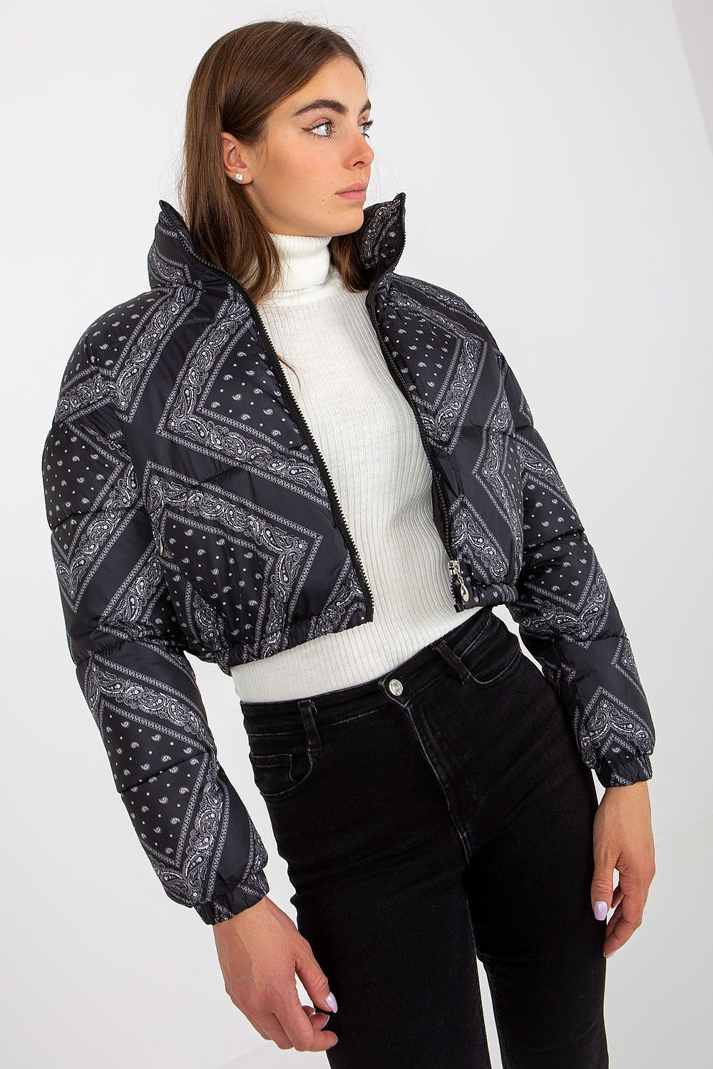 Fashion-forward NM polyester jacket for women in sleek black, adorned with intricate patterns, layered over a trendy turtleneck. A must-have for elevated winter ensembles.