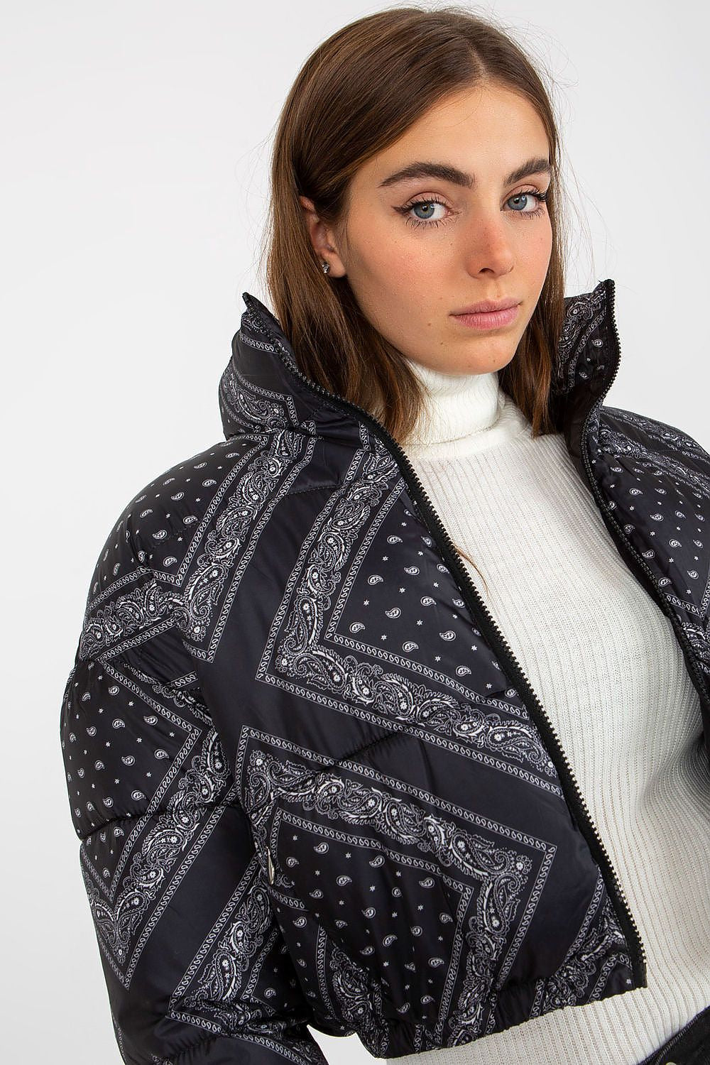 Luxury NM Polyester Jacket in stylish design, featuring a modern cut and intricate paisley pattern, modelled by a woman with a neutral background, showcasing elegance and warmth.