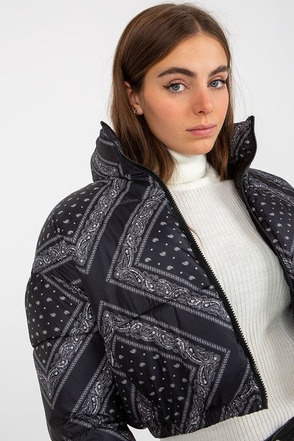 Luxury NM Polyester Jacket in stylish design, featuring a modern cut and intricate paisley pattern, modelled by a woman with a neutral background, showcasing elegance and warmth.