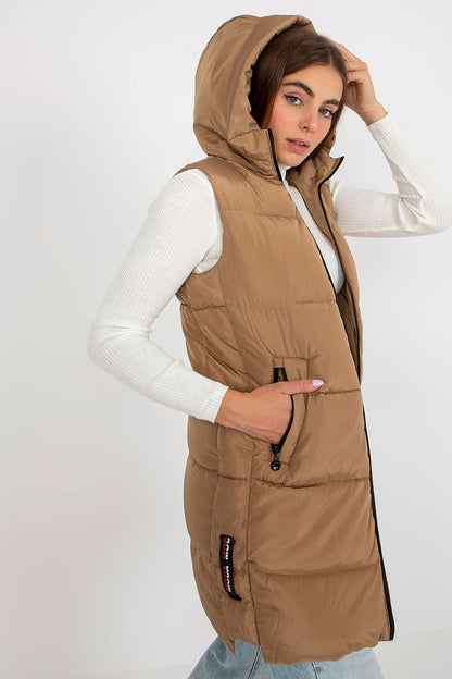 Elegant NM Gilet in premium beige polyester, model wearing a stylish hooded vest with tailored fit and pockets, exuding luxury and sophistication.