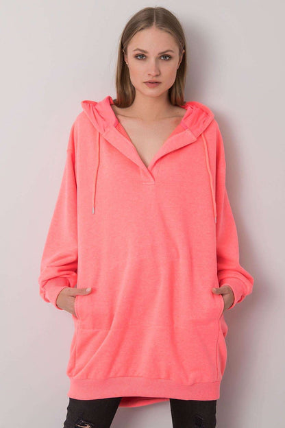 Chic women's extended cut hooded sweatshirt in vibrant neon pink, featuring a stylish kangaroo pocket, perfect for a luxurious casual look.