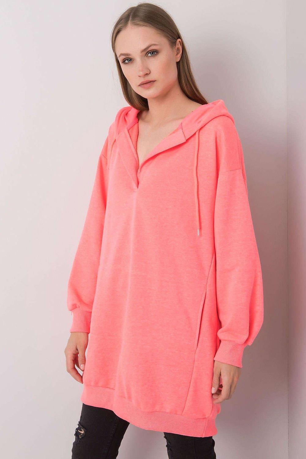 Elegant women's oversized pink hooded sweatshirt showcasing a contemporary design with a kangaroo pocket, ideal for everyday luxury wear.