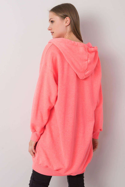 Sophisticated back view of a luxurious women's pink hooded sweatshirt, designed for ultimate comfort with an extended cut and stylish aesthetic.