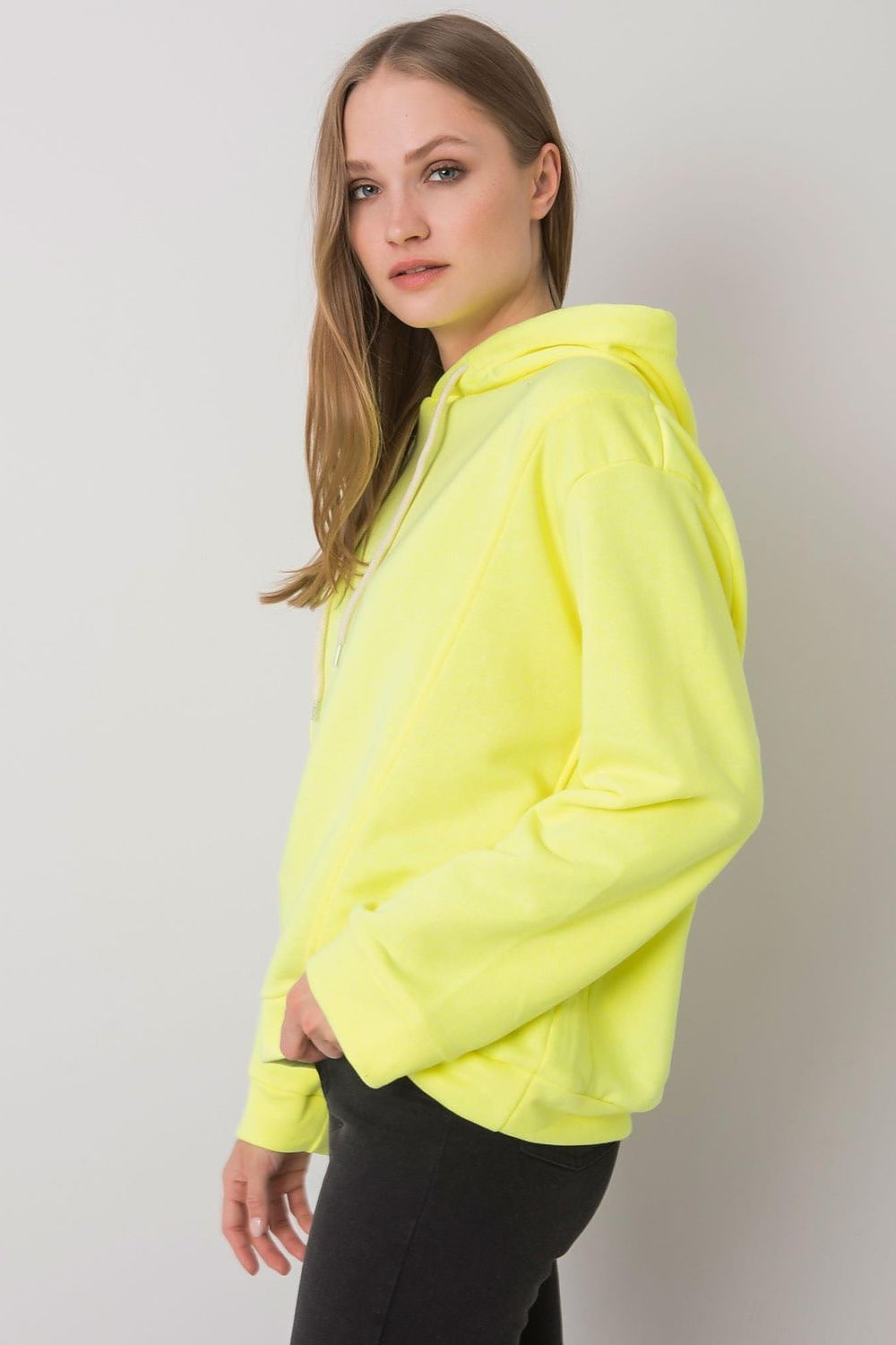 Fashionable women's yellow hoodie sweatshirt with a relaxed fit and long sleeves, showcasing a luxurious cotton blend for superior comfort.