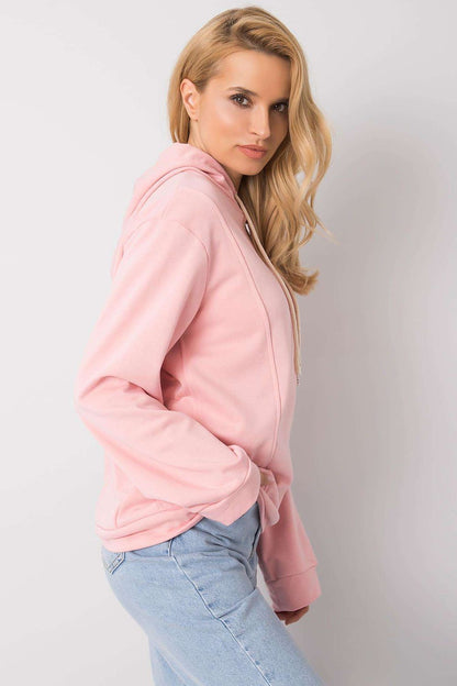 Side view of a luxurious pink women's hoodie sweatshirt made from cotton blend, showcasing stylish long sleeves and contemporary design.