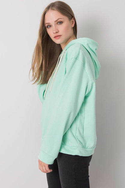 Chic women's cotton blend hoodie sweatshirt by Ex Moda in mint green, featuring a relaxed fit and long sleeves, ideal for fashionable everyday wear.