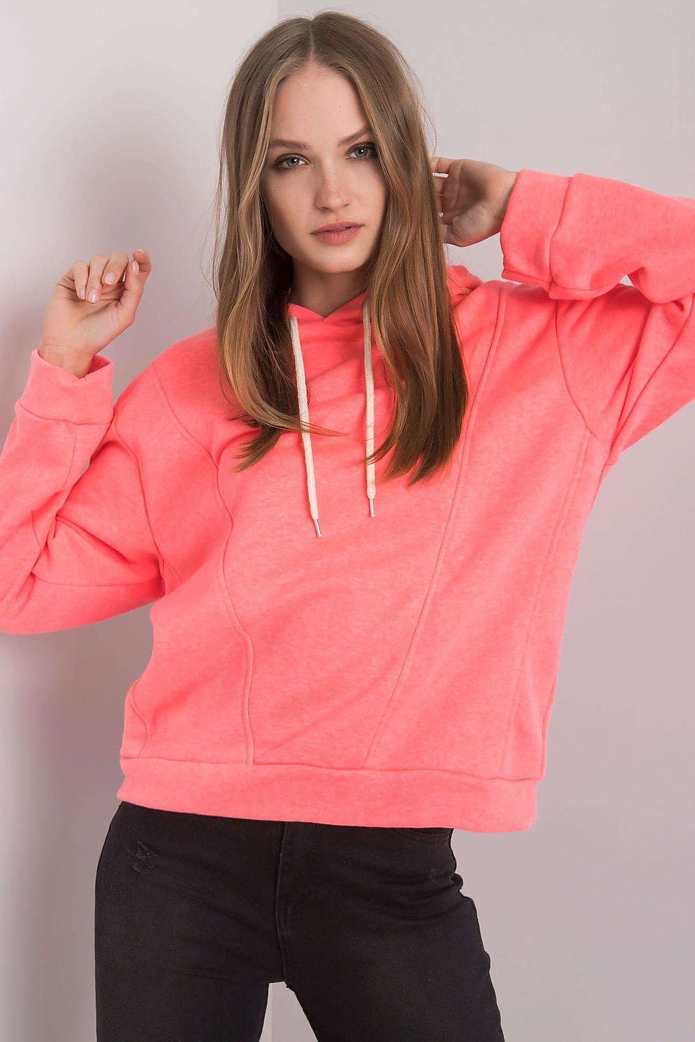 Chic women's cotton blend hoodie sweatshirt in bright pink, elegantly paired with denim, showcasing a relaxed style ideal for luxury casual wear by Ex Moda.