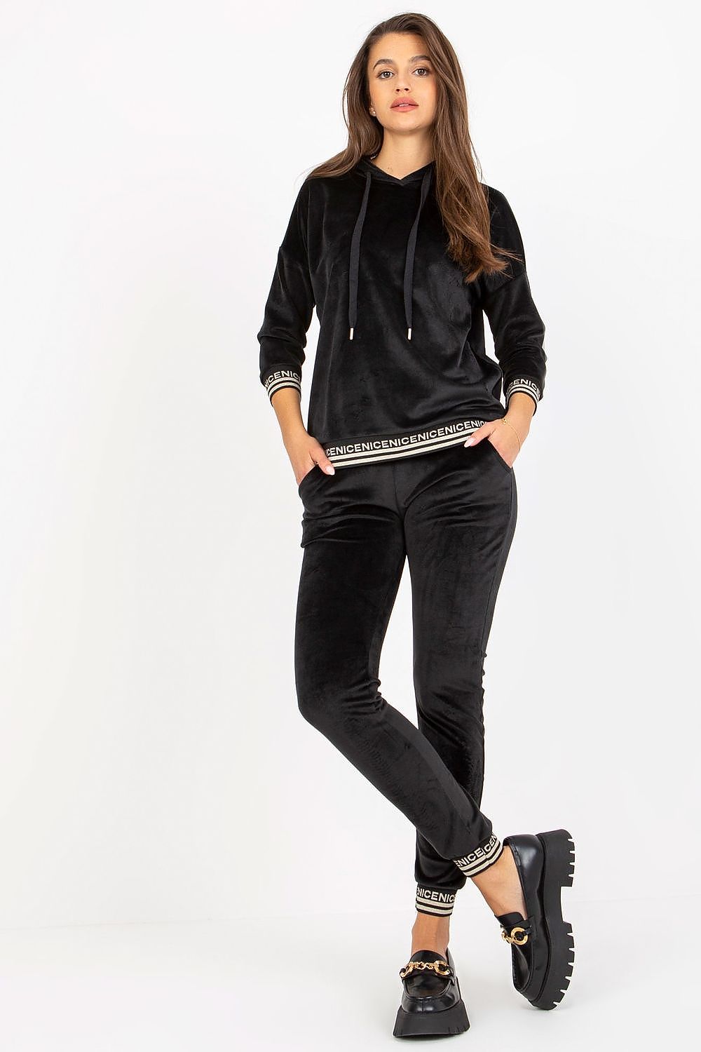 Elegant women's luxury velour loungewear set featuring a stylish 3/4 sleeve hooded sweatshirt and matching tie-waist pants, presented in classic black with decorative ribbed cuffs for a chic look.