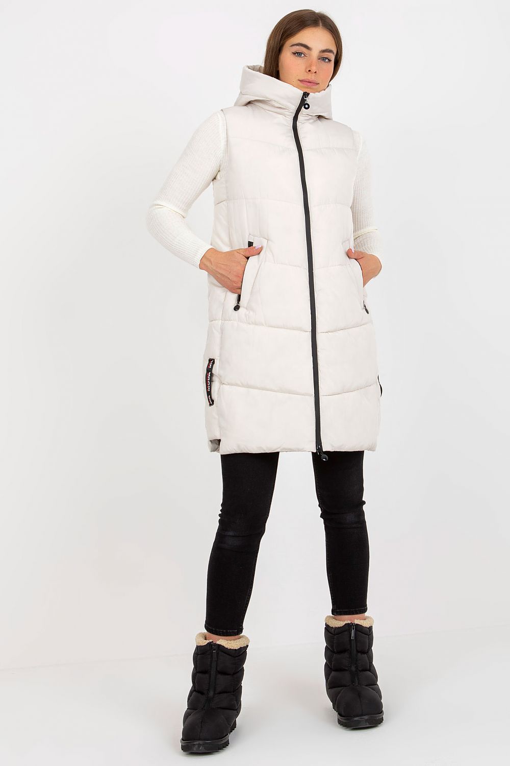 Front view of the Elegant NM Gilet in cream, accentuated with a stylish zip closure, showcasing its luxurious texture and contemporary appeal, perfect for both casual and formal settings.
