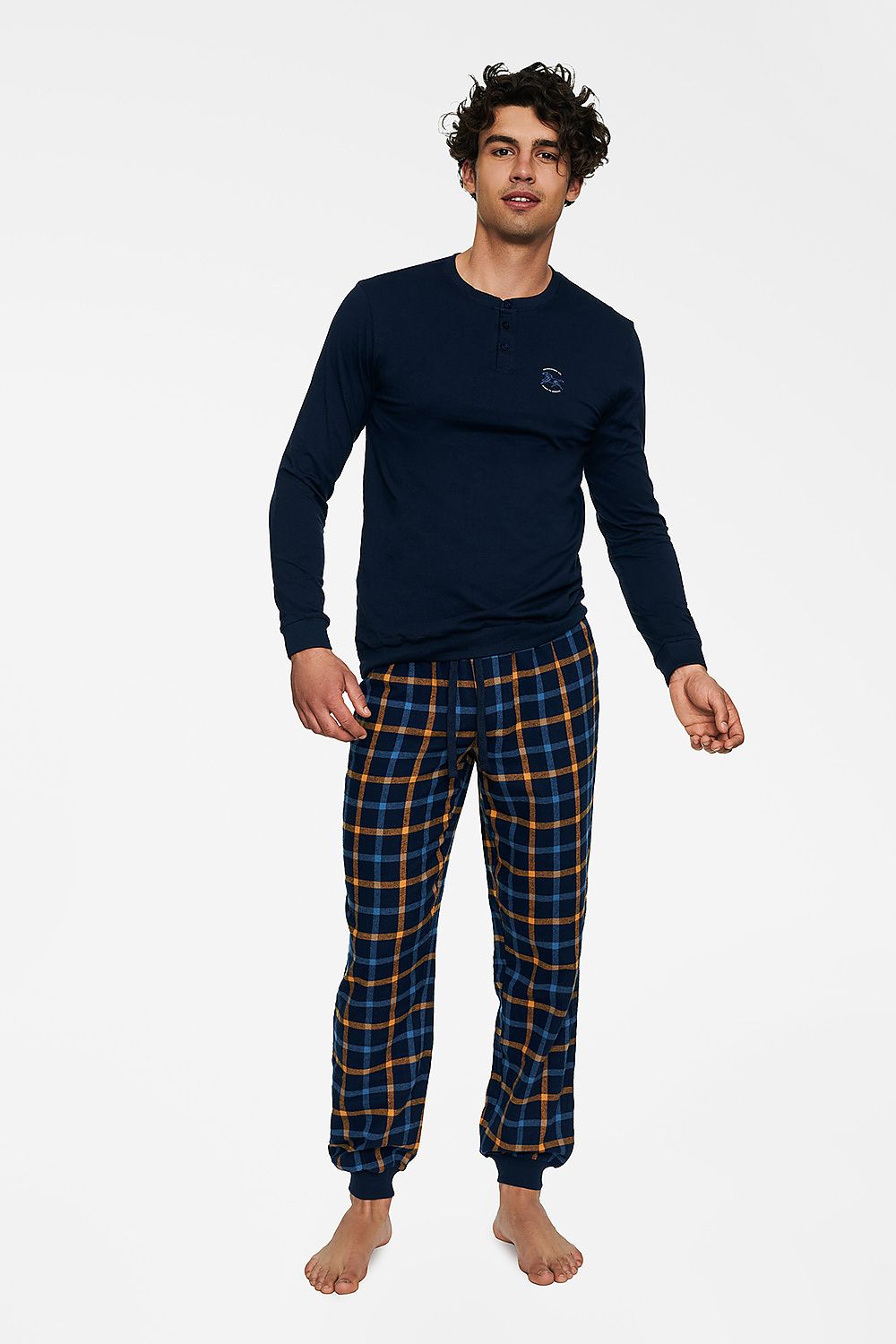 Luxurious men's 100% cotton pajamas set featuring a comfortable long-sleeve navy top and stylish checkered pants in blue and gold, perfect for relaxation and lounging.