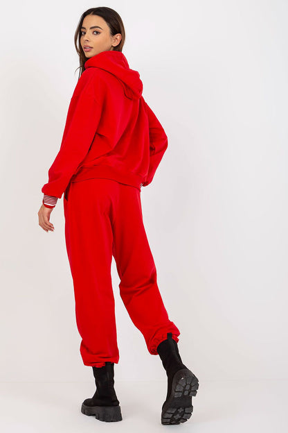 Back view of a stylish red cotton blend sweatshirt and pants ensemble, emphasizing a sophisticated sporty look.