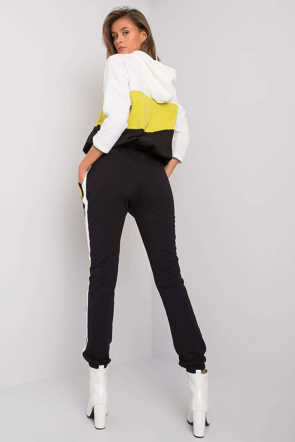 Refined back view of a stylish women's sweatshirt set in black and yellow, perfectly blending comfort with luxury aesthetics, featuring an elegant design.