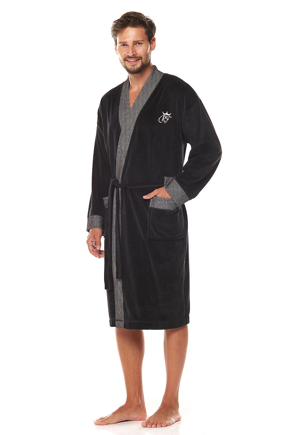 Luxurious men's black velour bathrobe featuring a shawl collar and patterned knit detailing, elegantly modelled by a man with a stylish charm.