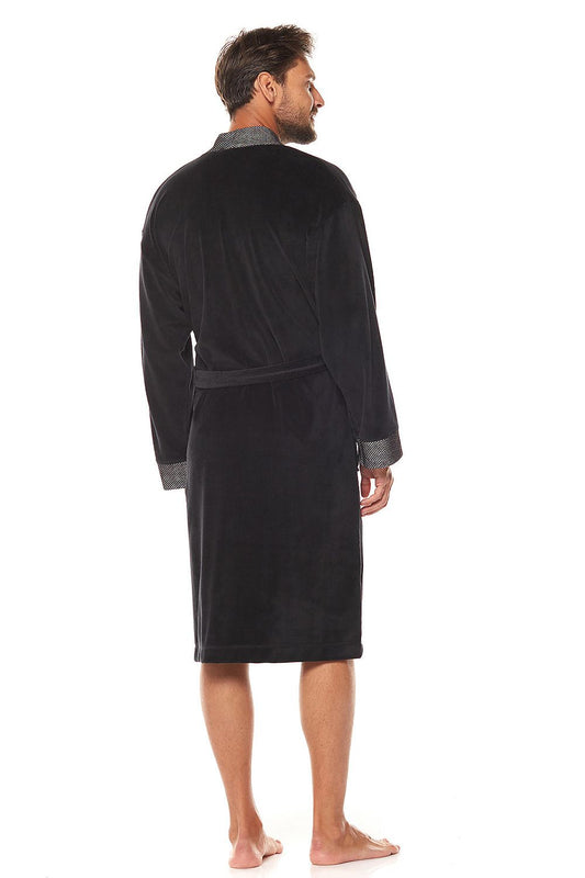 Back view of a premium men's black velour bathrobe showcasing the sophisticated shawl collar and stylish knit accents.