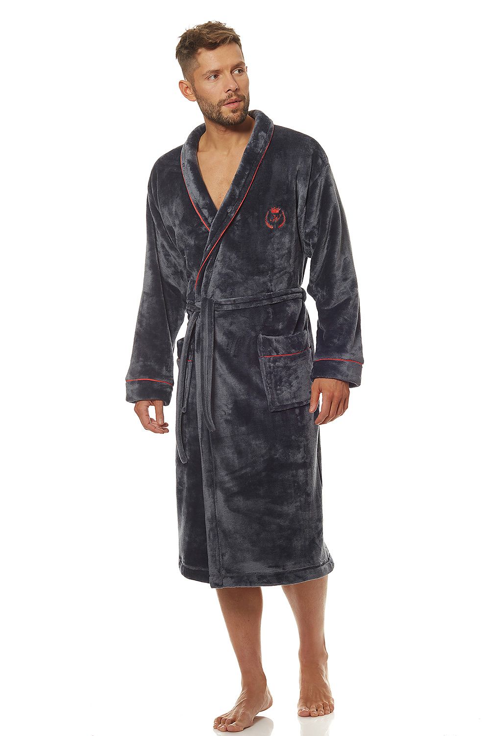 Luxury classic men's bathrobe in soft knit fabric, featuring a stylish design with a shawl collar, external pockets, and a tied waist, modelled by a man, showcasing elegance and comfort.