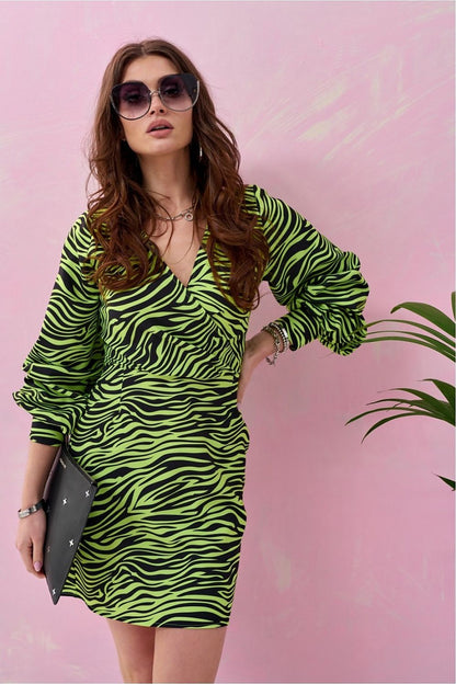 Vibrant green zebra print mini dress with long puff sleeves, modeled by a chic woman accessorised with sunglasses and a stylish clutch, set against a pastel background, ideal for eye-catching fashion.