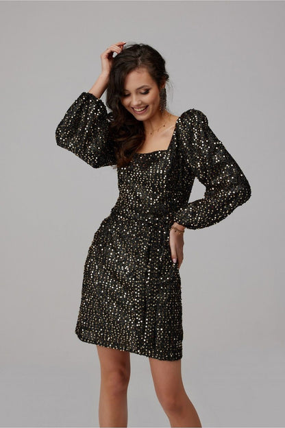Chic black sequin mini dress with voluminous puff sleeves, tailored for a glamorous look, highlighting sophistication and style.