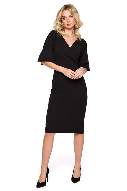 Elegant black off-shoulder evening dress by Makover, featuring a flattering mini length and delicate sleeves, perfect for sophisticated events.