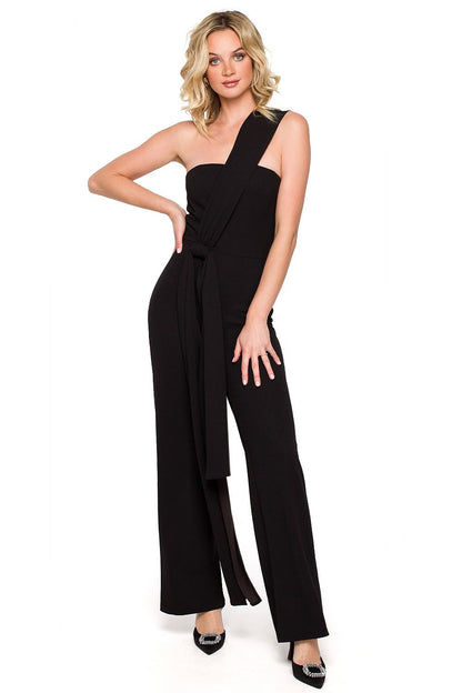 Elegant black jumpsuit with sash detail, featuring a one-shoulder design and wide-leg trousers. Perfect for chic evening events, made from high-quality Lycra and polyester blend for a flattering fit.
